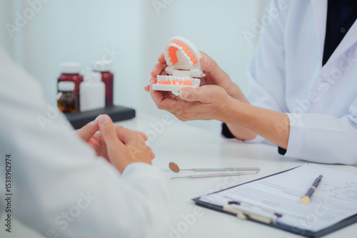 Dentist gives interesting advice about dental health, young man, focusing on oral health and dental care, dental or dental health concept.	