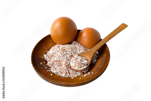 Broken or Crushed Egg Shells on Wood plate.