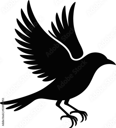 Silhouette of a bird with outstretched wings perched on the ground on a plain background