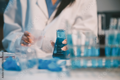 Research, experiment and medical trial being done by a scientist in a lab, science facility or hospital. One young, serious and professional researcher organizing, sorting or making a discovery