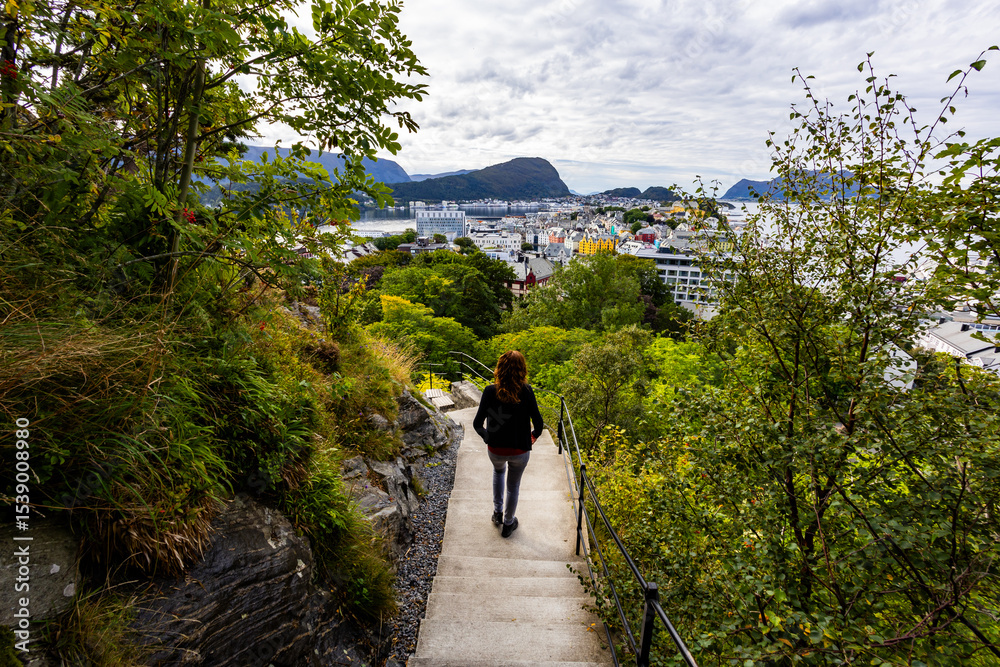 Fototapeta premium Young woman in Alesund city from view point, Norway, Europe
