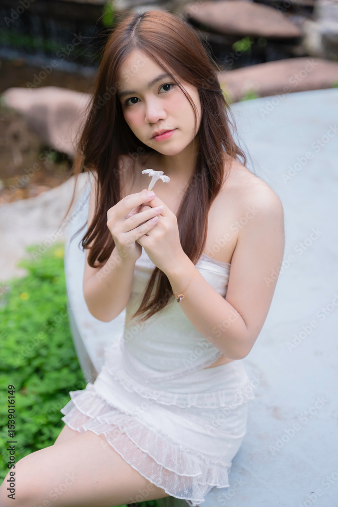 Portrait of beautiful young asian woman wear white dress outdoor,Lifestyle of modern woman Portrait of beautiful young asian woman wear white dress outdoor,Lifestyle of modern woman