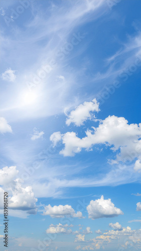 blue sky with white cumulus and cirrus clouds