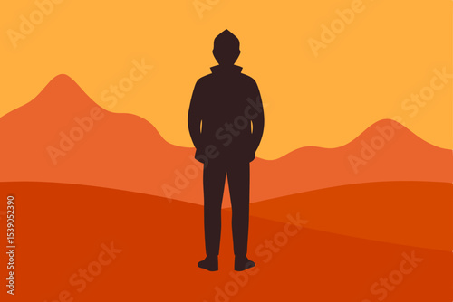 silhouette of a man sitting on the sand
