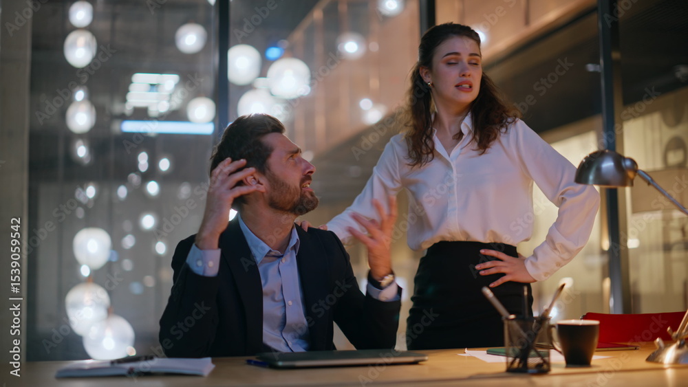 Fototapeta premium Stressed professionals worried problem at overtime in dark office. Nervous team