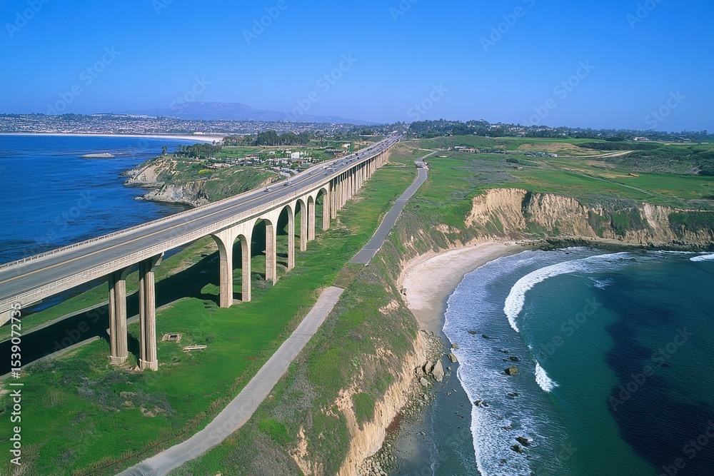 Obraz premium Views of Cabrillo Bridge and Cabrillo Freeway along the coastline with ocean waves, Aerial of Cabrillo Bridge and Cabrillo Freeway