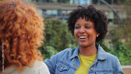 Two women experiencing a joyful moment as they share a heartfelt embrace filled with warmth and genuine happiness, showcasing the beauty of friendship and connection in their lives.