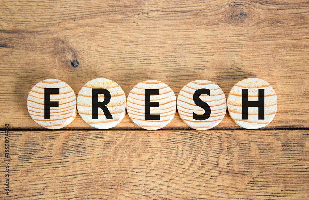Fototapeta premium Fresh symbol. Concept word Fresh on beautiful wooden circles. Beautiful wooden table wooden background. Business lifestyle fresh concept. Copy space.