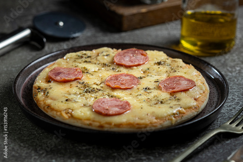 Small personal pizza. Calabrian sausage pizza.