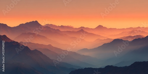 Wallpaper Mural View of layered mountains with a hazy orange sky during sunset in a scenic landscape scene view Torontodigital.ca