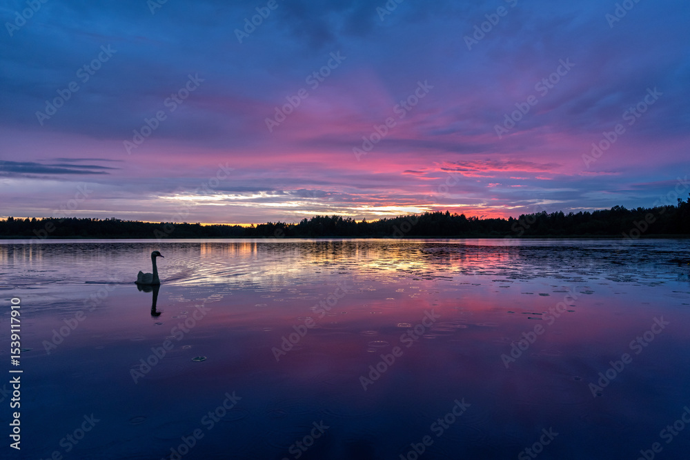 Fototapeta premium Summer sunset on the lake after the rain