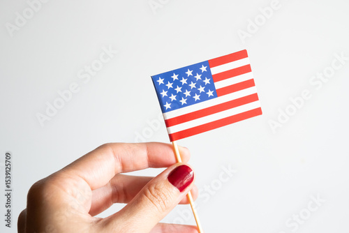 One hand holding american flag