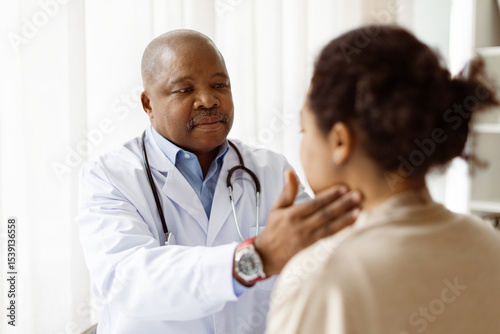 Bild auf Leinwand African American doctor man checking lymph nodes of young patient woman during a