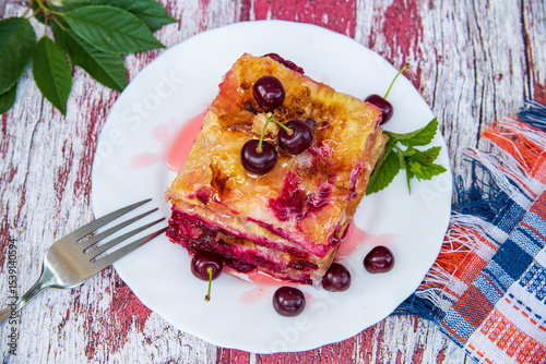 baklava with cherries on the table