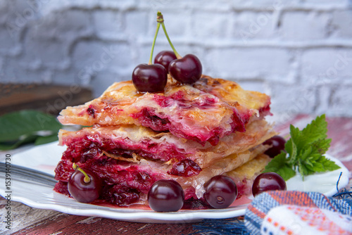 baklava with cherries on the table