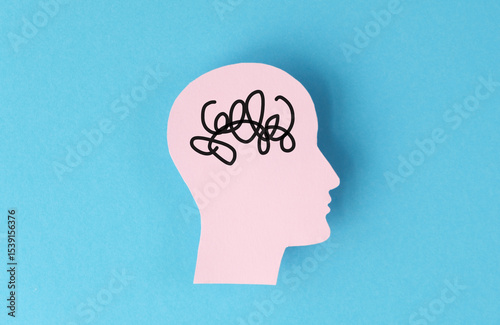 A head with a brain that is tangled and messy