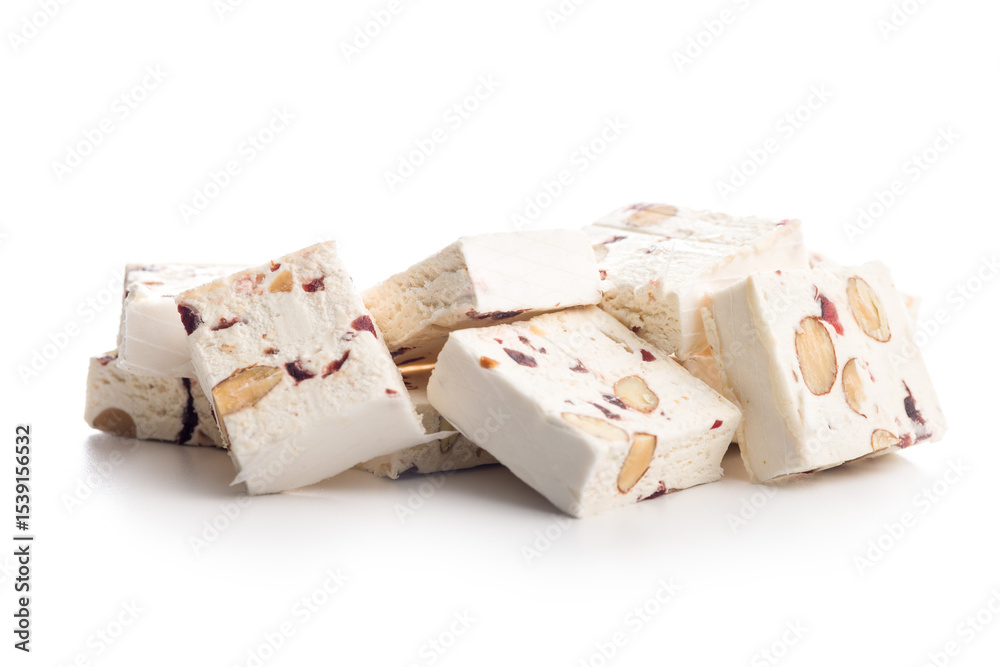 Fotografie White nougat bars with almonds and dried fruit isolated on white background