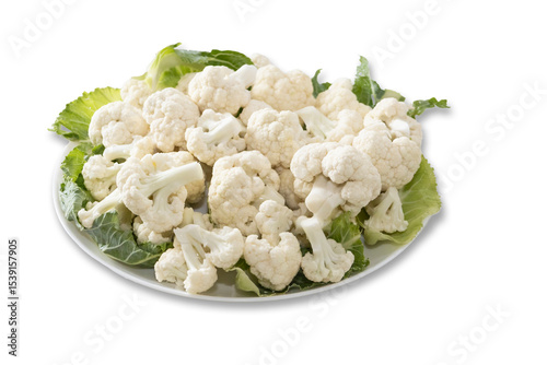 Fresh and raw cauliflower on the white plate.  The cauliflower  -  vegetable is cut into pieces on white background. The vegetable is divided into inflorescences on the plate