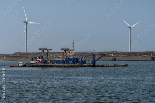 Fototapeta dredger is anchored in the North Sea Canal in the Netherlands