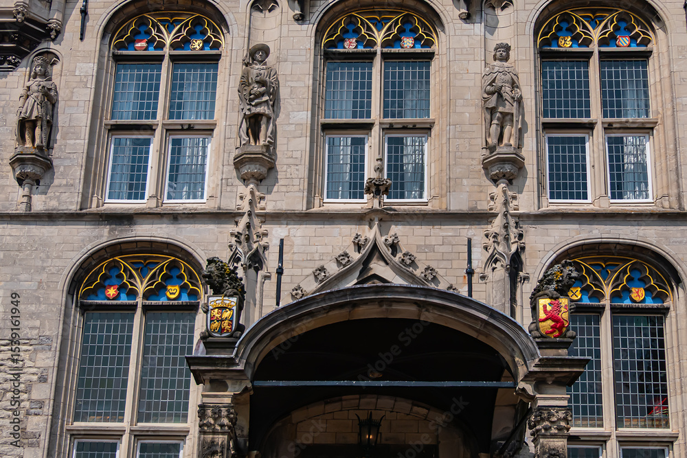 Fototapeta premium Old Town Hall of Gouda (Stadhuis van Gouda, 1448 - 1450), it is one of oldest Gothic city halls in the Netherlands. Architectural fragments of the façade. Gouda, the Netherlands.