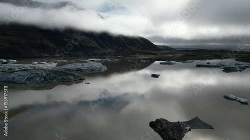 Glacier Meltwater Lake and Mountains Seen from Drone in Iceland