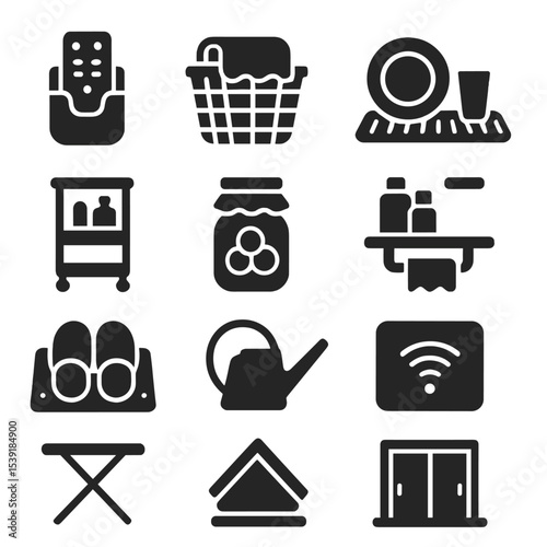 Home Essentials Icons. Solid style icons of home essentials: wall-mounted TV remote holder, extra blanket basket, dish drying mat