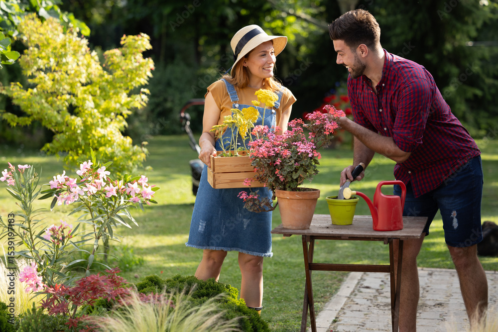 Obraz premium Gardeners working together in vibrant backyard