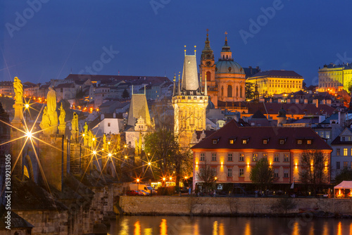Photography Evening view of Charles Bridge and Old Town in Prague, Czech Republic with illum