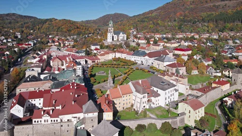 Flight over of old town Kremnica at autumn, Central Slovakia.