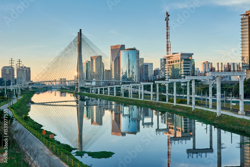 Wallpaper Mural Urban cityscape with a cable-stayed bridge, modern buildings, and the Pinheiros River in the city of São Paulo. Torontodigital.ca