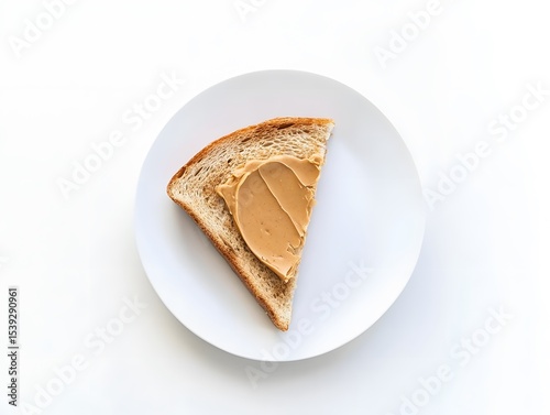 Minimalist breakfast featuring a single diagonal slice of peanut butter toast on a plain background.