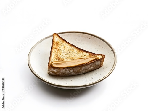 Minimalist breakfast featuring a single diagonal slice of peanut butter toast on a plain background.