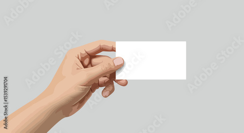 Female hand holding blank white paper against light blue-gray background