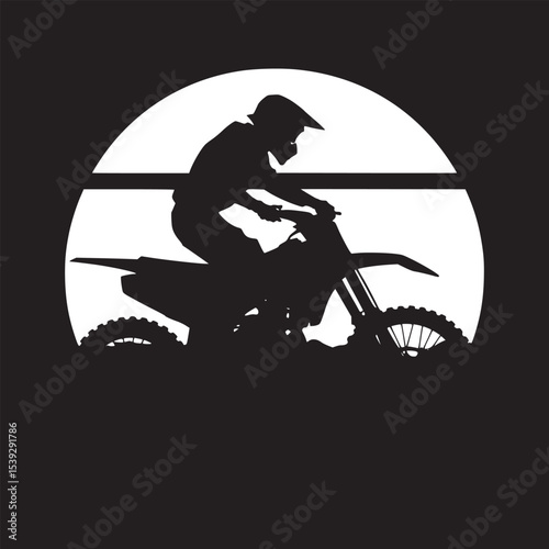 Silhouette of a motorcyclist on a dirt bike against a sunset background with a red and orange sky