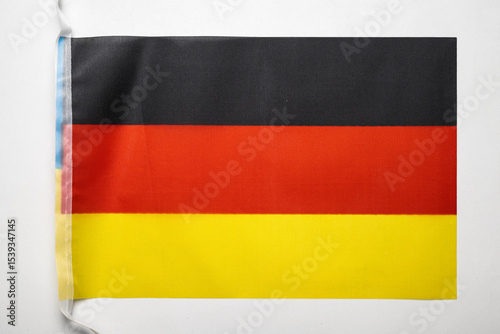 Closeup view of the German national flag isolated over a white background. Concept of government and nationality Free Download Closeup view of the German national flag isolated over a white background. Concept of government and nationality - GFXLoad