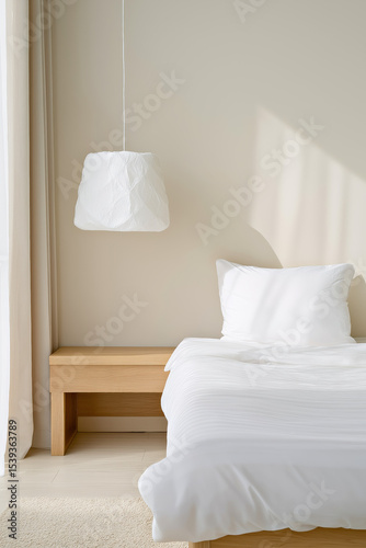 Minimalist Bedroom Interior with White Bedding and Soft Natural Light