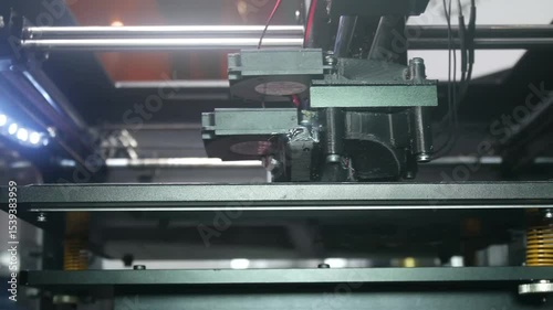 3D printer machining several plastic parts in series. Technology concept, innovation, manufacturing, development, electronics, industrial, machining, production, design, hardware, machines, future