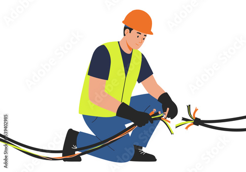 Kneeling electrician in helmetgloves splicing cables