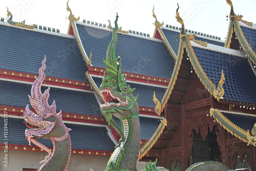 Colorful of Naga statues in Thai art decorate the steps of the ordination hall at Wat Den Sali Si Mueang Kaen temple. Located at Cheng Mai Province in Thailand.