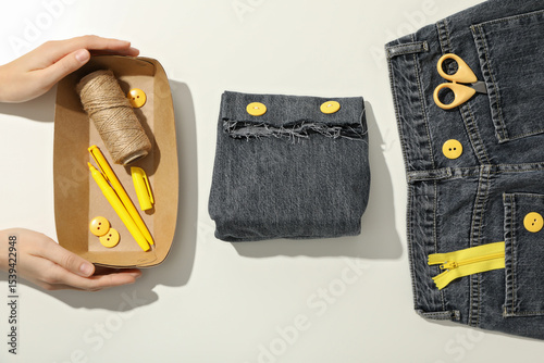 Wallpaper Mural Handmade denim bag, materials, tools and hands on white background, top view Torontodigital.ca
