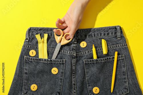Wallpaper Mural Jeans, tools and hand on yellow background, top view Torontodigital.ca