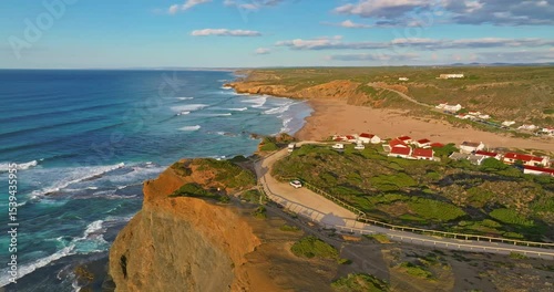 Aerial view of Aljezur Portugal. A small, cozy, traditional surf town at sunset