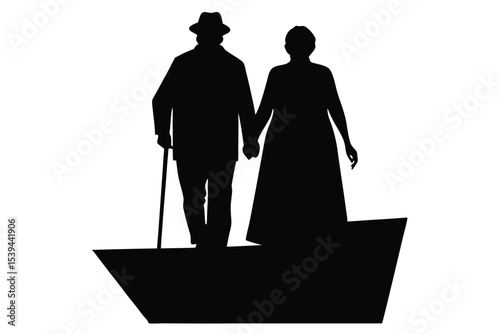 Silhouette of elderly couple walking hand in hand