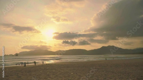 Serene sunset at eye level on a tropical Indonesian coastline – perfect natural beauty and golden hour glow.