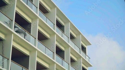 4K low angle shot of an Indonesian resort building against a bright blue sky – tropical architecture in high resolution