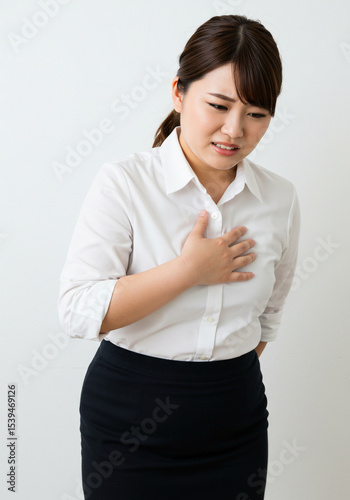 A curvy woman felt pain in her chest, an expression of pain.
