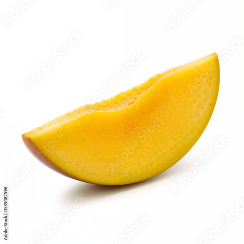 Juicy mango slice sits solo showing vibrant colors against a clean white backdrop