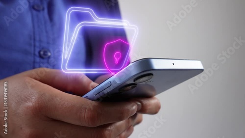 Close-up of a person's hands holding a cell phone and a hologram of a folder icon with a checkmark, cloud document management concept