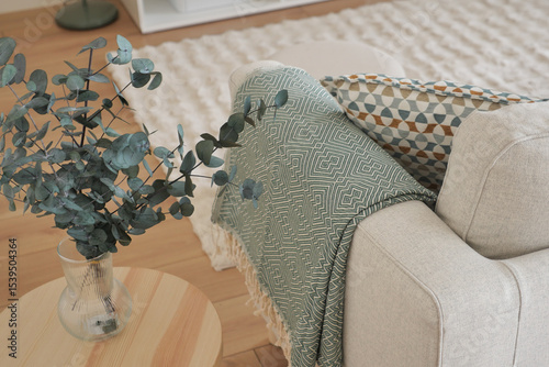 Fototapeta Naklejka Na Ścianę i Meble -  Cozy living room with minimalist decor and greenery