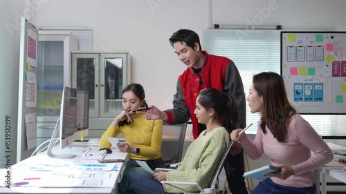 Professional design team working collaboratively on mobile app user interface and user experience, analyzing interface strategies in modern startup office environment